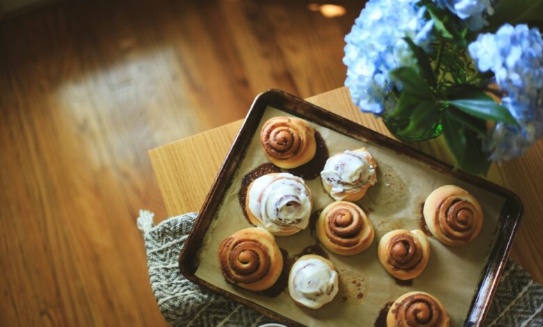 a tray of pastries sitting on top of a wooden table