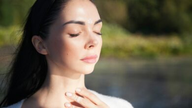 a woman with her hands on her chest